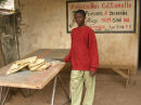 Oumar brings school work for Bassidy to check